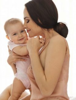 Young attractive mom in sleepwear smiling hugging kissing her baby sitting in bed over window. Closed eyes. Copy space.